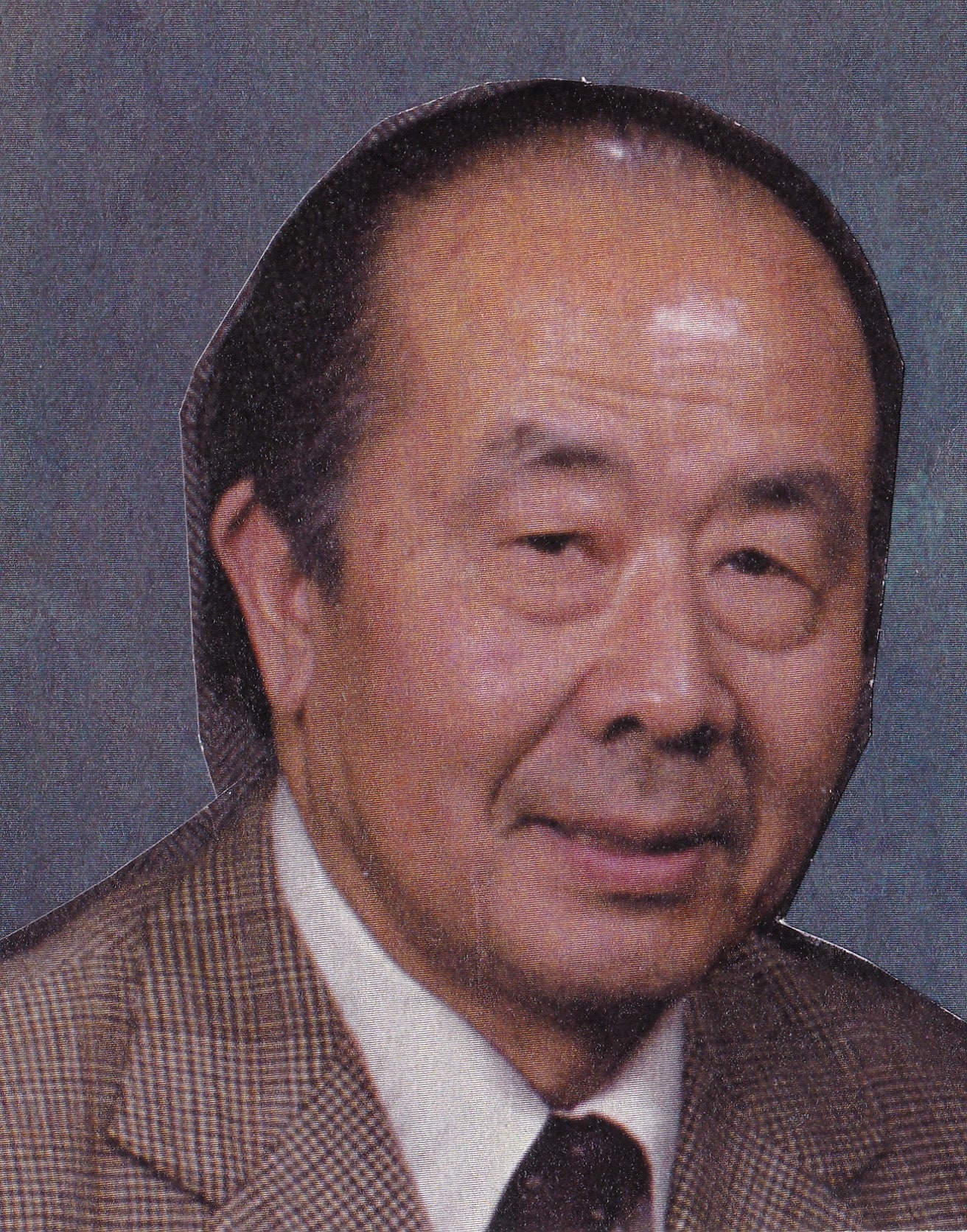 Gilbert Ling in jacket and tie, a head-and-shoulders portrait from a scanned print.