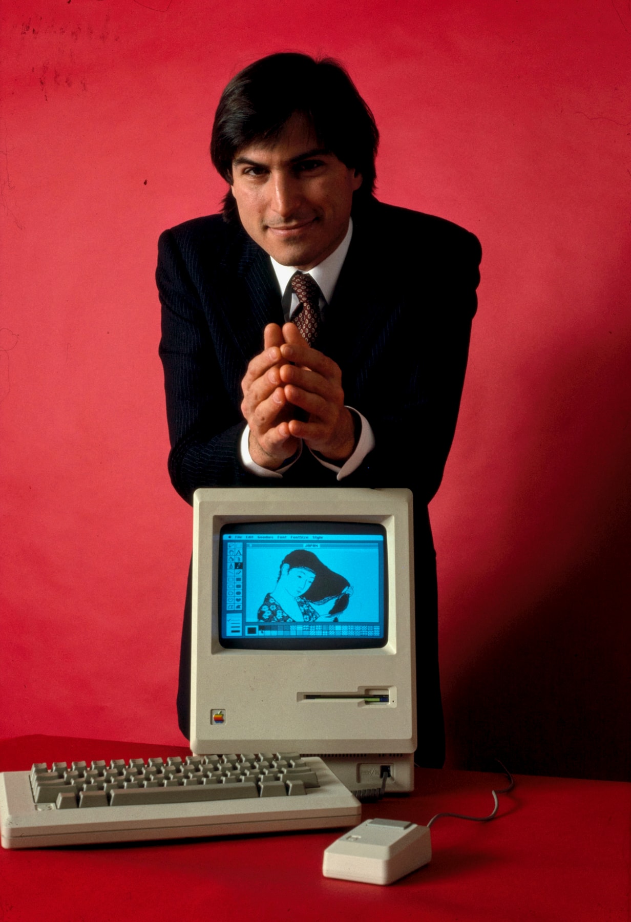 Steve Jobs with a Macintosh computer in January 1984.